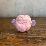 "Pink Ball With Wings"