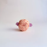 "Pink Ball With Wings"